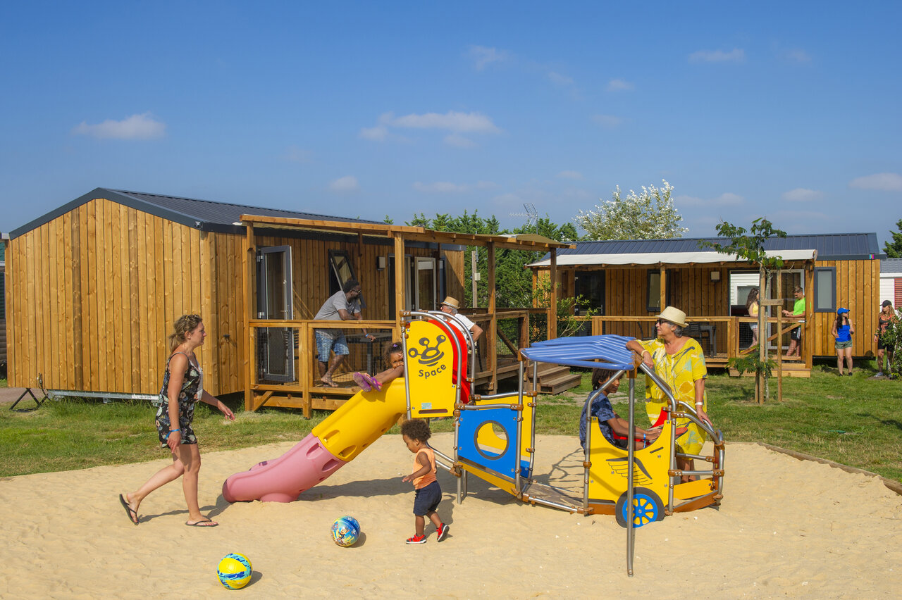 Children's playground and modern Mobile-homes at CAPFUN Celeste campsite in Breuillet (17).
