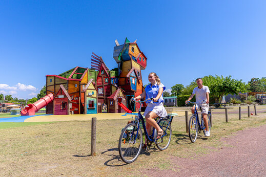 Large colorful play structure with giant slide at CAPFUN Celeste campsite in Breuillet (17).