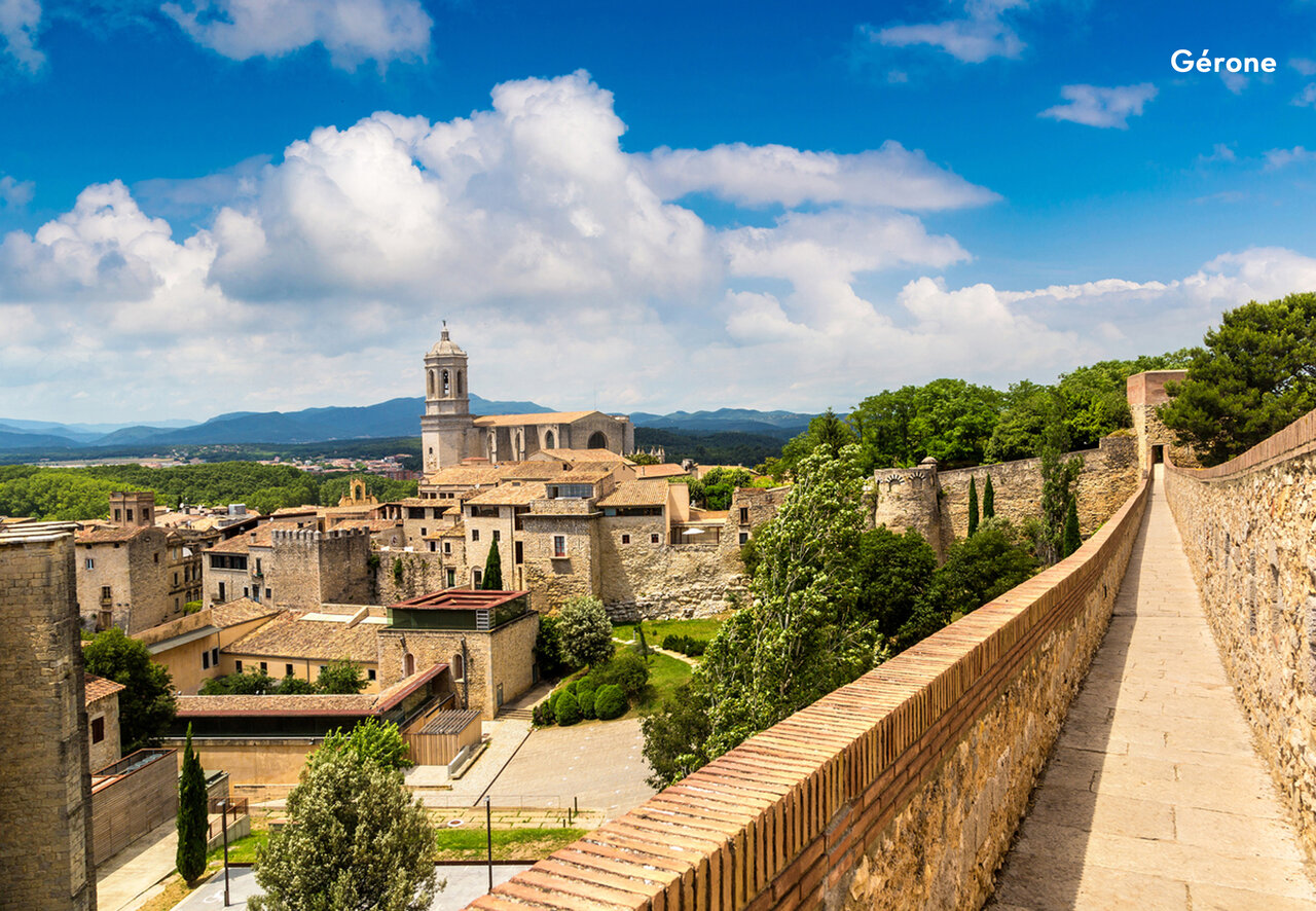 Historic walls and cathedral of Girona, a city to visit in Catalonia.