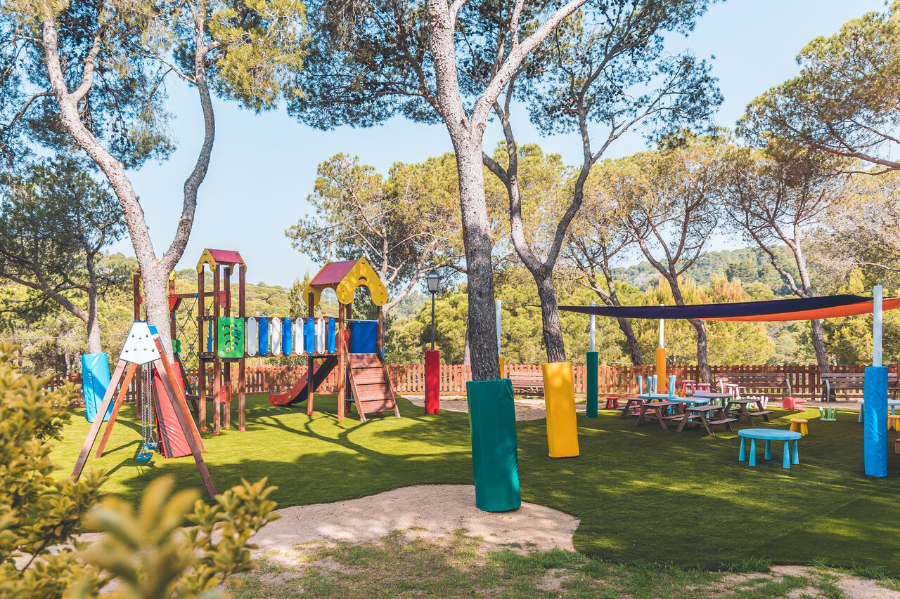 Colorful children's playground with slides and swings at CAPFUN Treumal campsite in Platja d'Aro (17).