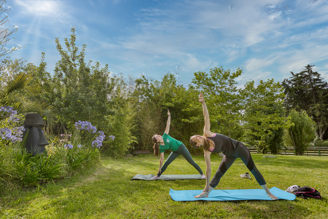 Outdoor yoga activity at CLICOCHIC Trois Ch�nes campsite in Pornichet (44).