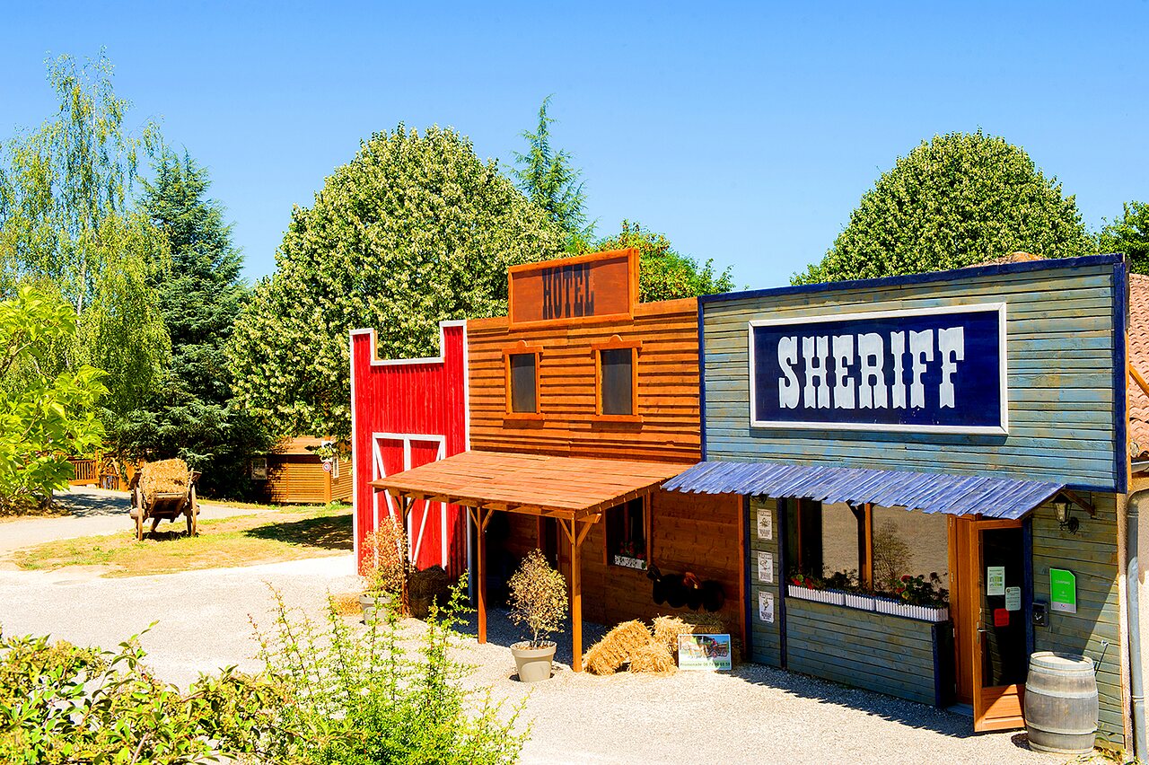 Decorative Western village, Hotel and Sheriff buildings at CAPFUN Ullule campsite in Tournon d'Agenais (47).