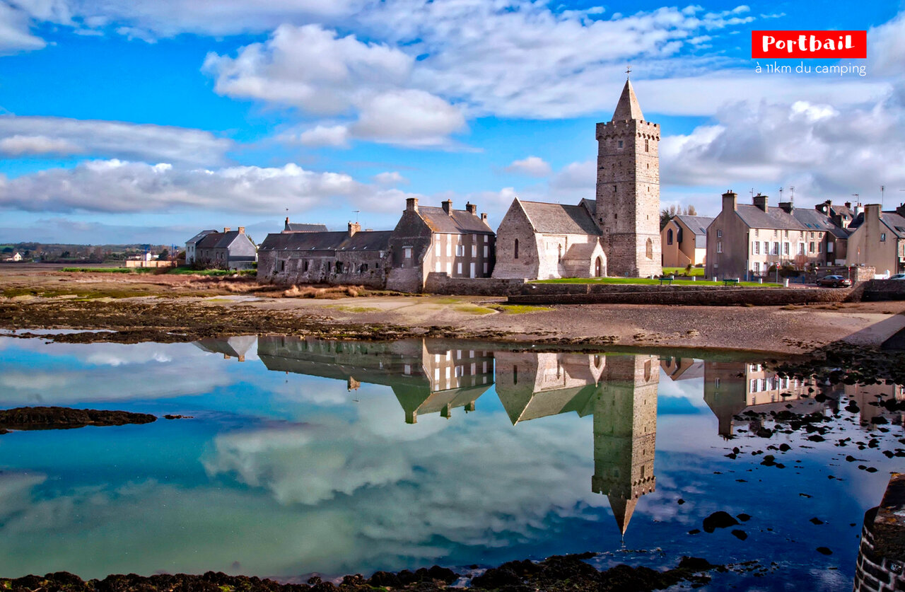 Portbail village with its historic church and reflection, to visit in Normandy.