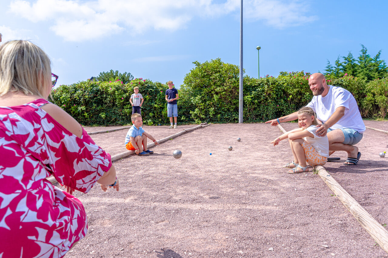 Family playing p�tanque at CAPFUN Vikings campsite, Saint Jean de la Rivi�re.