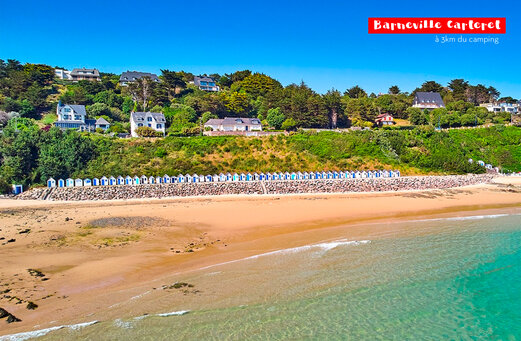 Sandy beach and colorful beach huts in Barneville Carteret, Normandy.