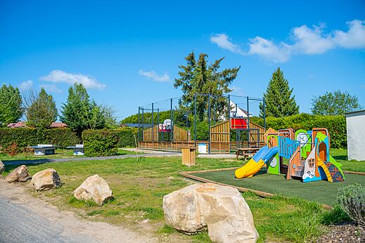 Colorful playground and multi-sport court at CAPFUN Le Village Parisien campsite VARREDDES (77).