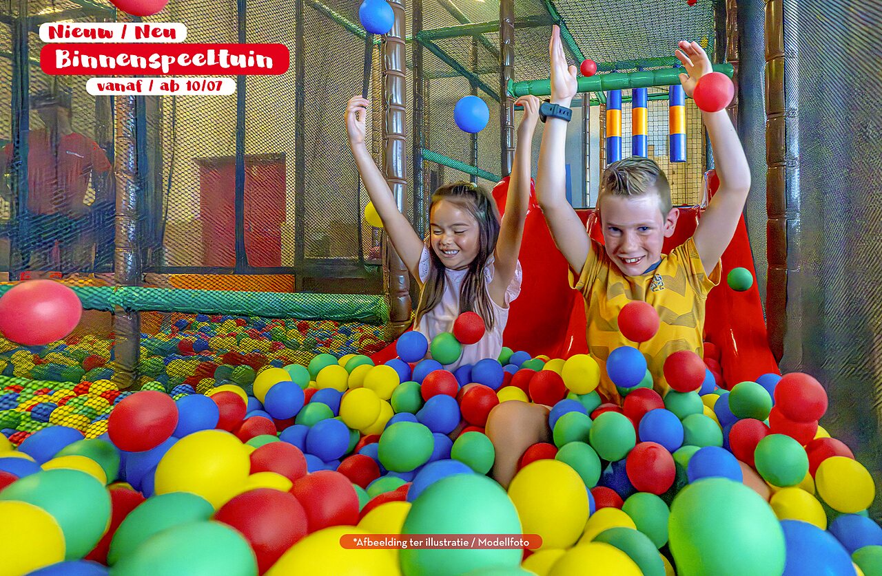 Indoor playground, children in colorful ball pit at CAPFUN Vlinderloo campsite, Enschede.