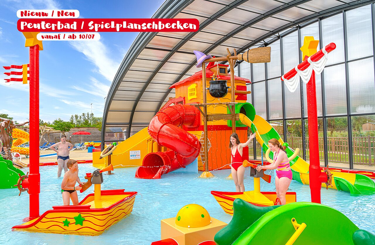 Covered pool, waterslides and water games at CAPFUN De Waldsang campsite, Bakkeveen.
