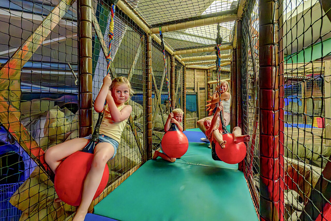 Indoor play area with ball swings, CAPFUN Wondermolen campsite in Molenschot.