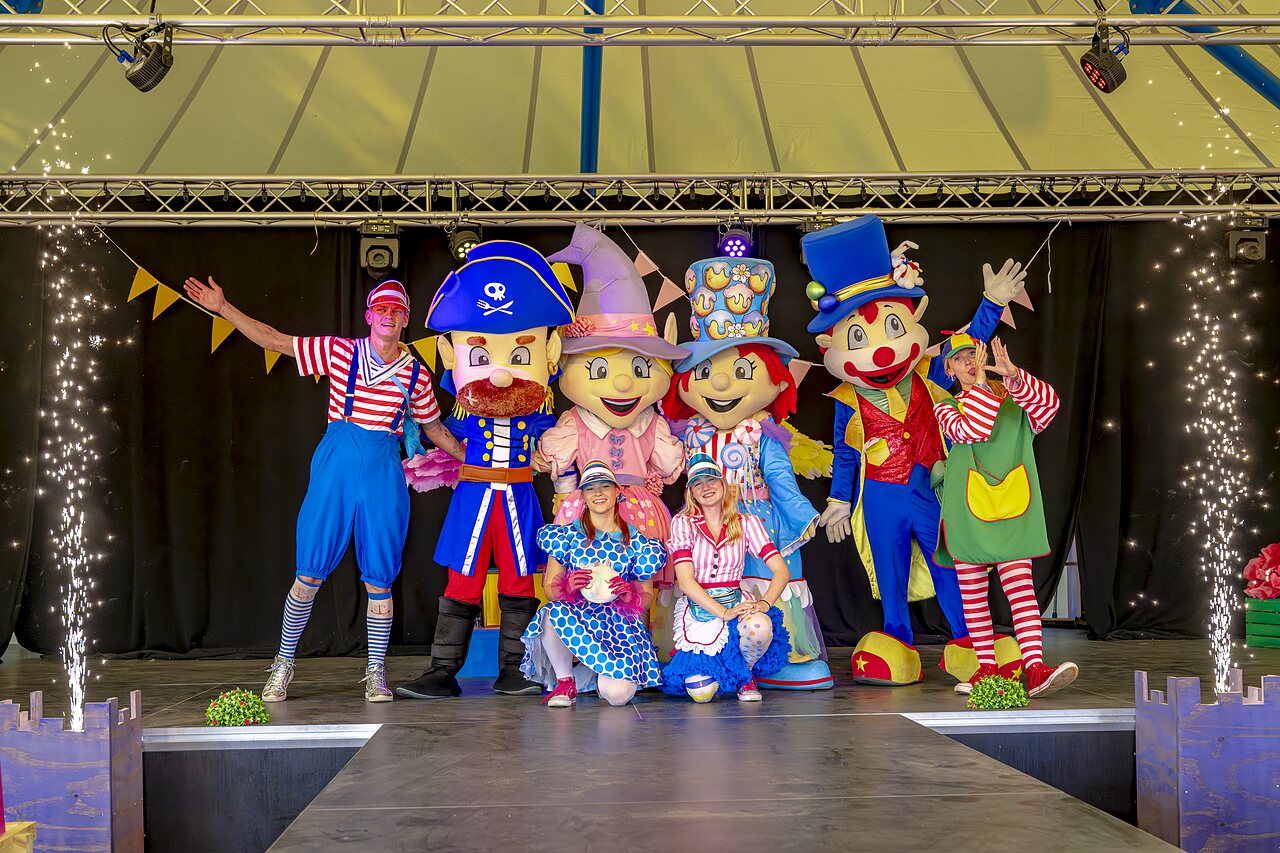 Mascots and animators on stage with pyrotechnic effects at CAPFUN Wondermolen campsite in Molenschot.