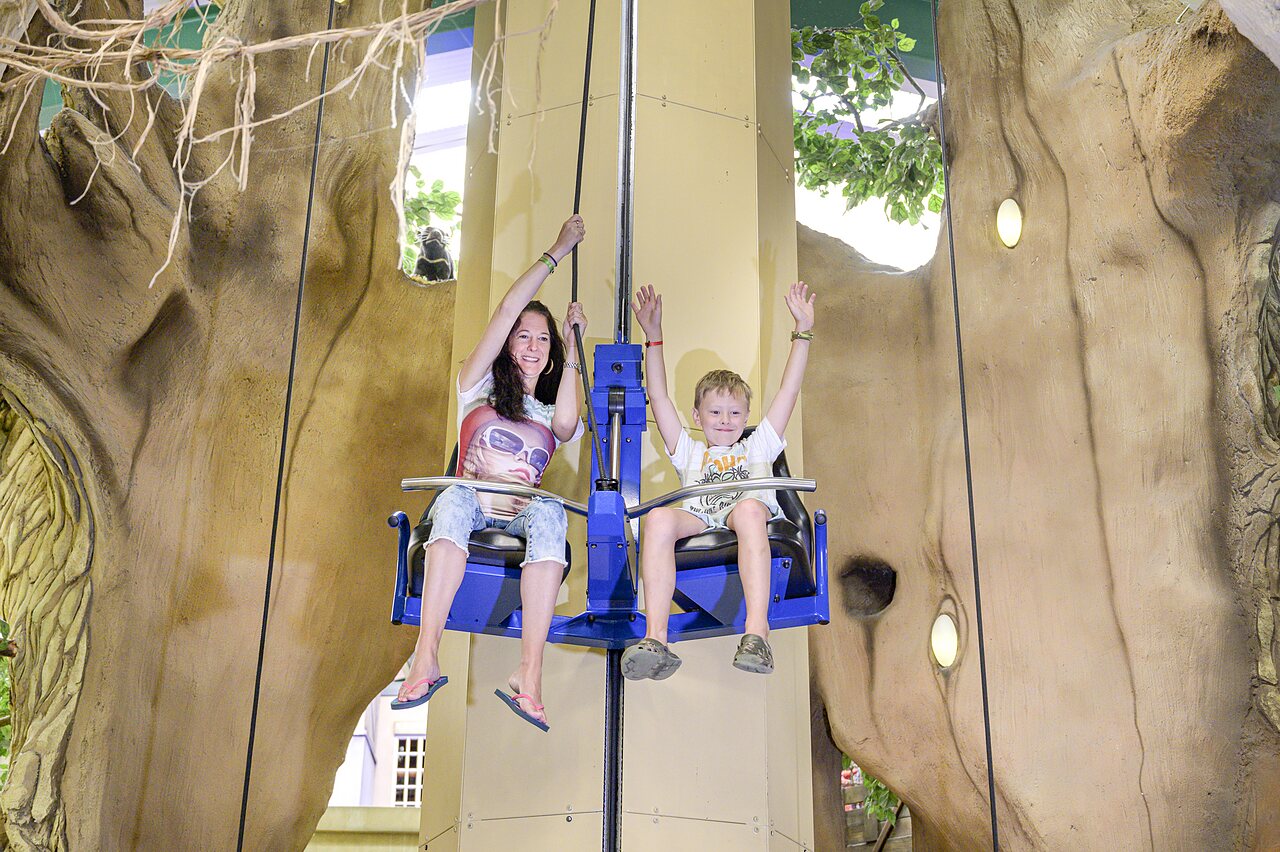 Mother and child on indoor vertical ride at CAPFUN Wondermolen Molenschot.