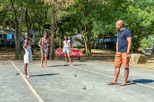 Pétanque court with family at CAPFUN Zagarella campsite in LONGEVILLE SUR MER (85).